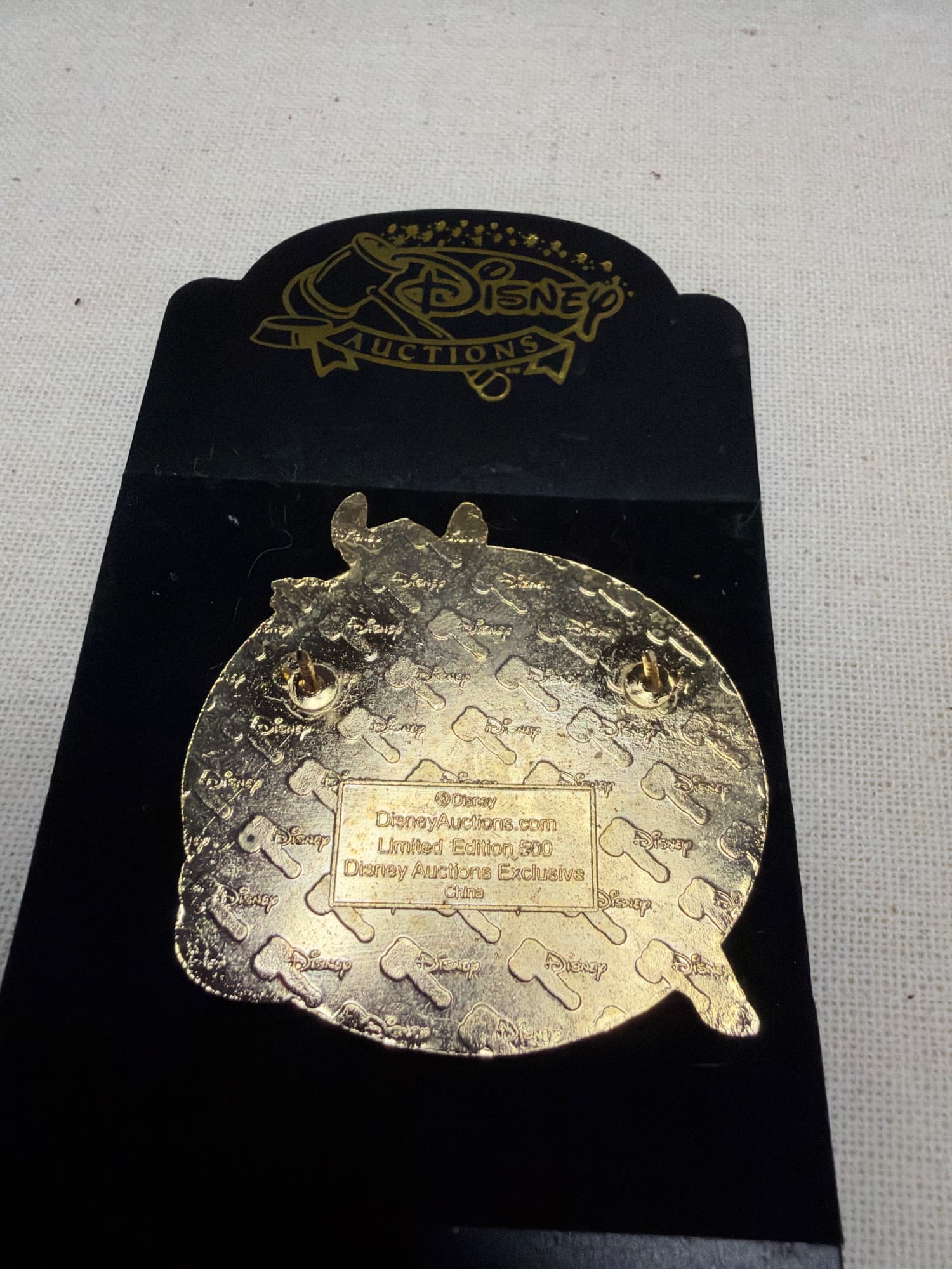 Stitch Christmas Auctions Pin, the back