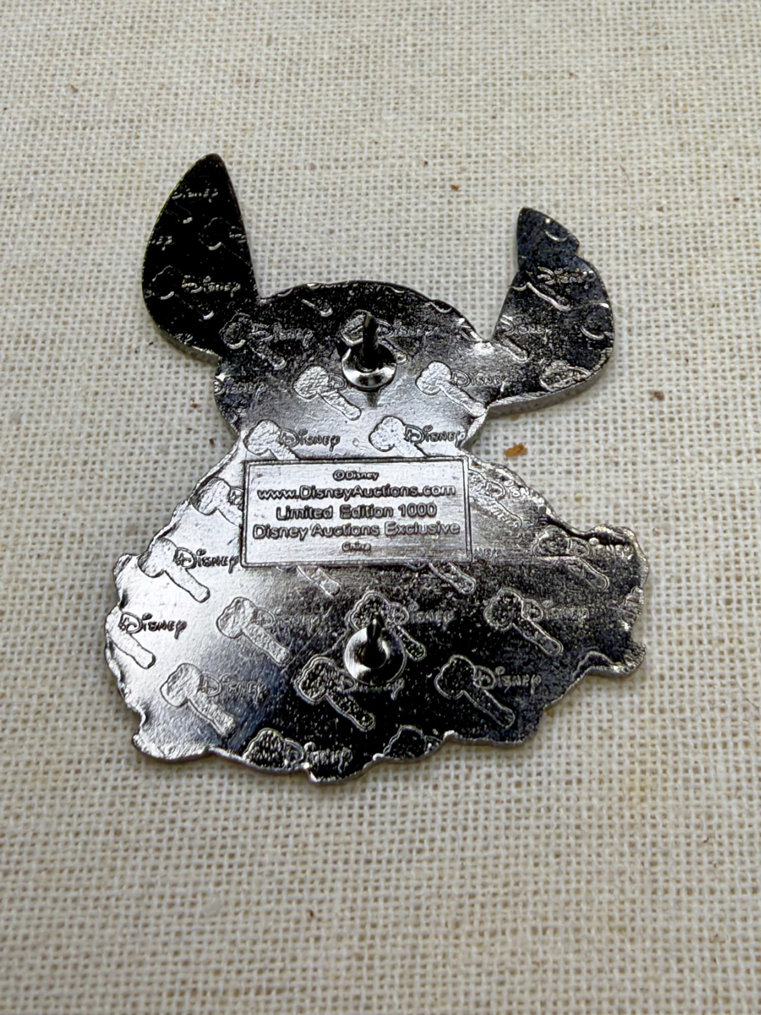 Stitch With Candy Auctions Pin, the back