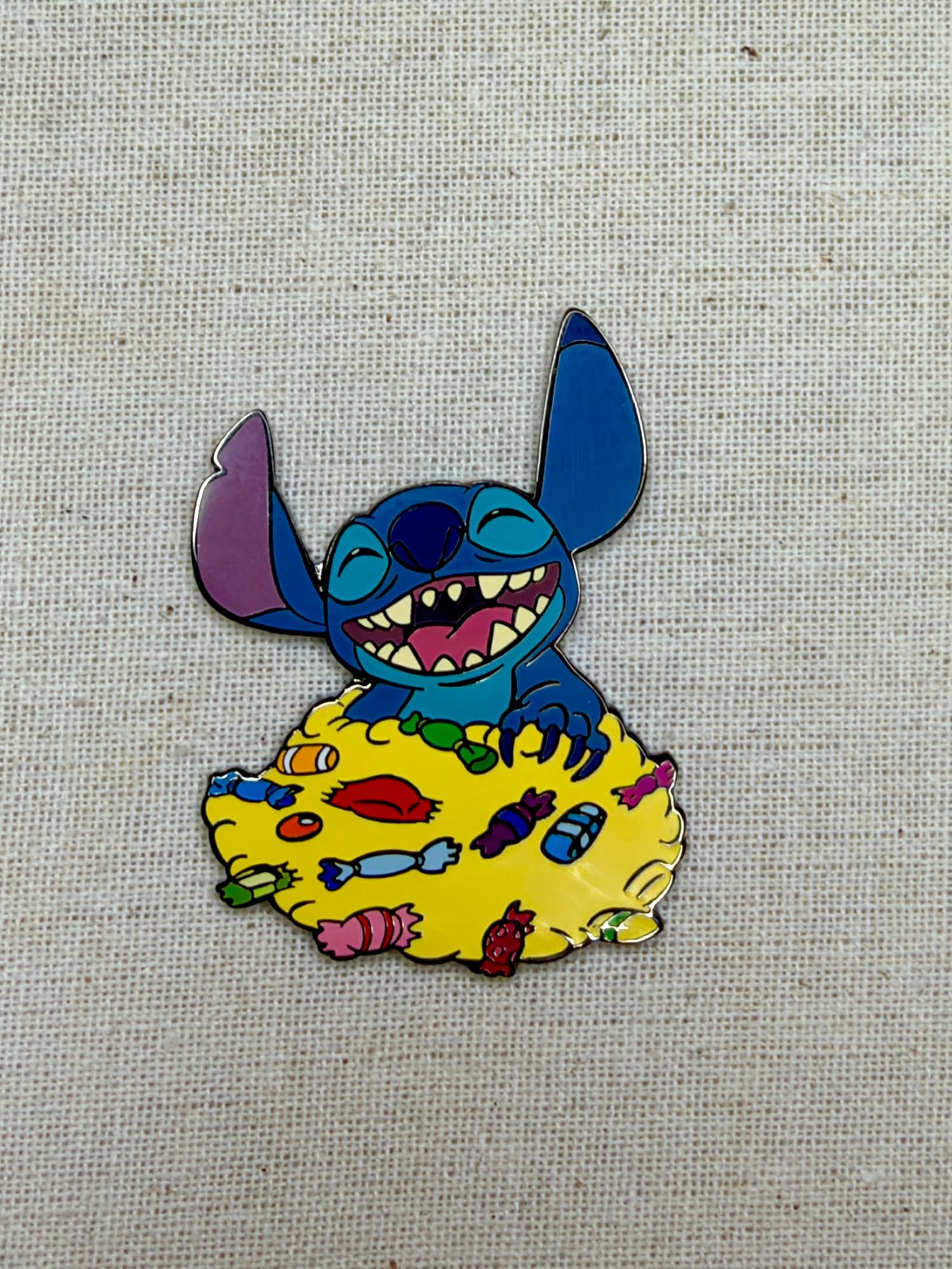 Stitch With Candy Auctions Pin, the front