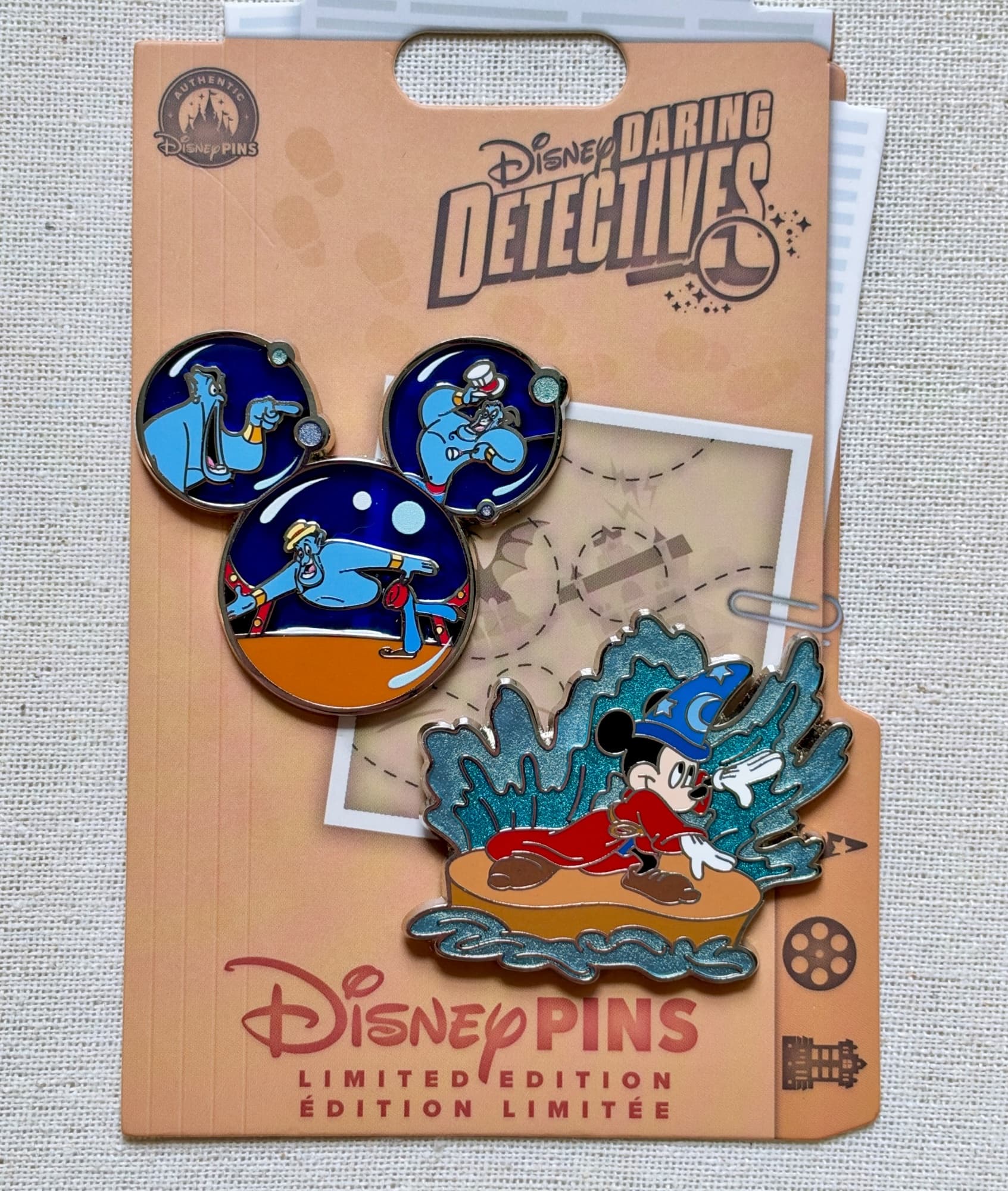 Daring Detectives Fantasmic Pin Set, the front