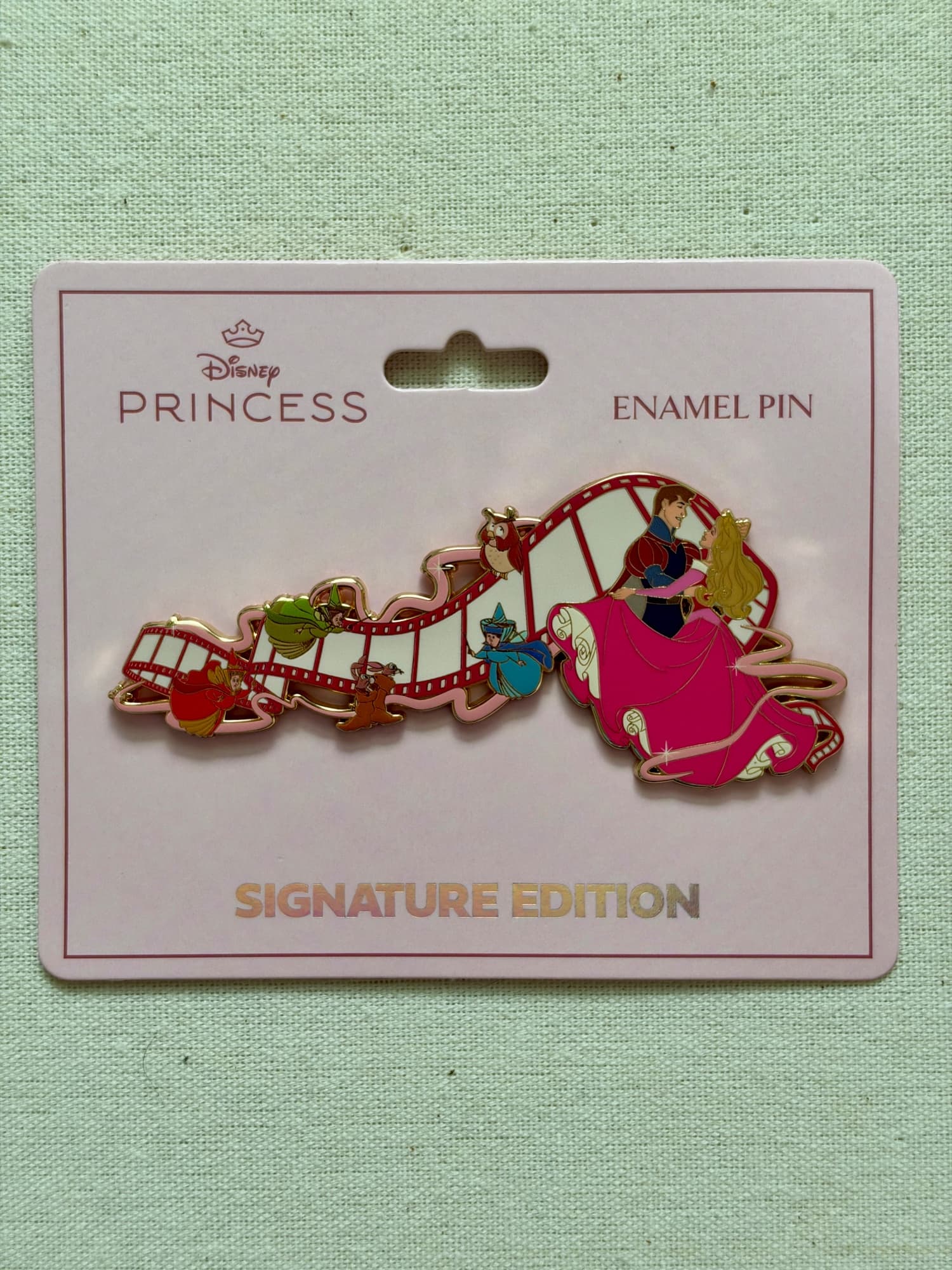 Monogram Jumbo Magic of the Movies Pin - Aurora, the front